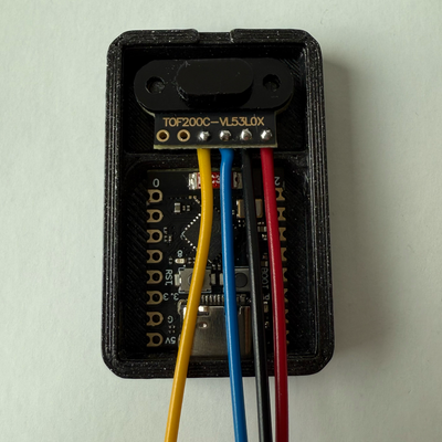 Insert the TOF200C and ESP32-C3 Into Enclosure