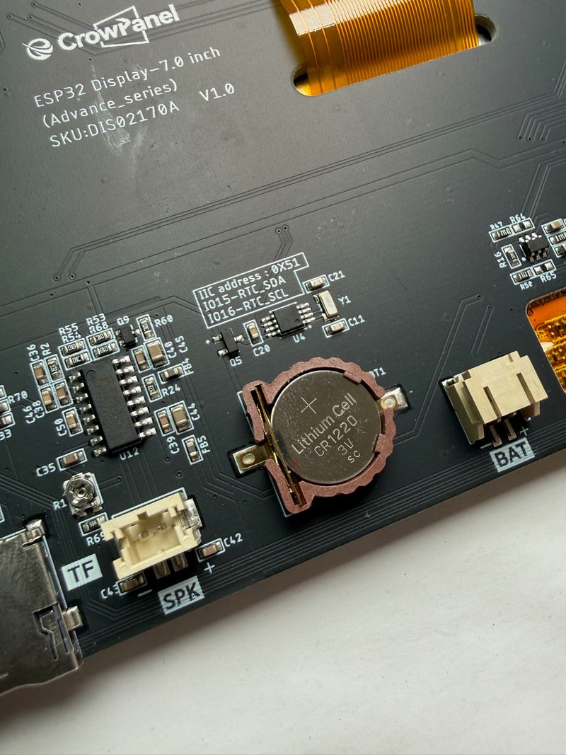 Close-up of the CR1220 coin-cell holder that backs up the RTC on the CrowPanel Advance 7.0 ESP32-S3